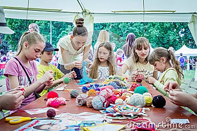 Outdoors children activity - knitting workshop Editorial Stock Photo